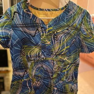 Blue patterned scrub top. Size medium fits like a small